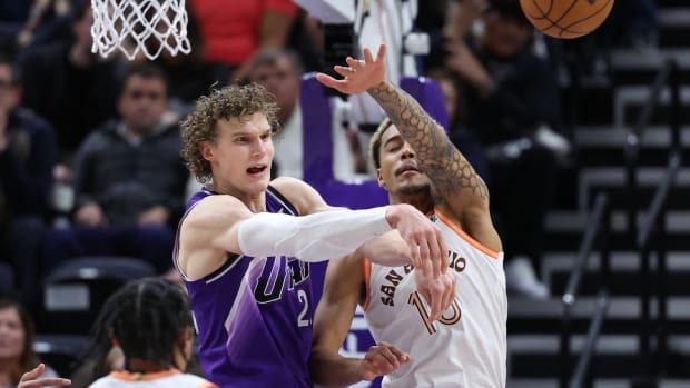 Feb 25, 2024; Salt Lake City, Utah, USA; Utah Jazz forward Lauri Markkanen (23) passes the ball away from San Antonio Spurs forward Jeremy Sochan (10) during the fourth quarter at Delta Center.